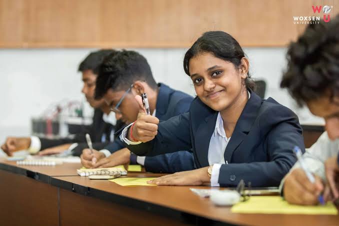 MBA students in classroom discussing business case study with professor representing management education and career growth in 2026